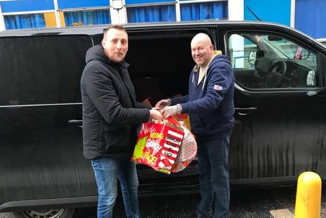 Martin Westrop from Monks Inn helping to transport the gifts