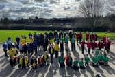 Pupils and staff formed the Olympic rings logo using their house colours and staff kit.