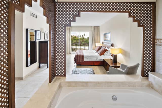 The main bedroom’s palatial bath is impressive