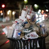 An overflowing bin used for illustrative purposes. (Photo by Yasuyoshi CHIBA / AFP) (Photo by YASUYOSHI CHIBA/AFP via Getty Images)