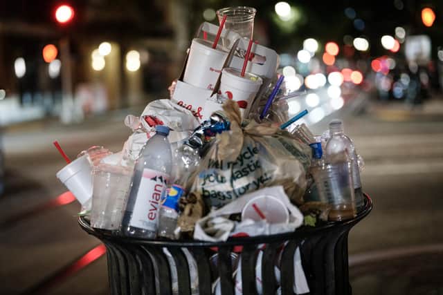 An overflowing bin used for illustrative purposes. (Photo by Yasuyoshi CHIBA / AFP) (Photo by YASUYOSHI CHIBA/AFP via Getty Images)