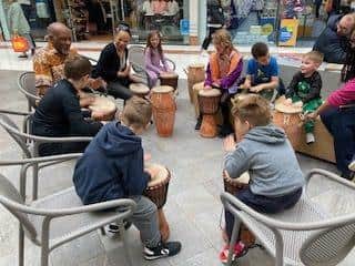 Shoppers and charity members gathered to enjoy a drumming session at the Marlowes. Image: Yvonne Davis
