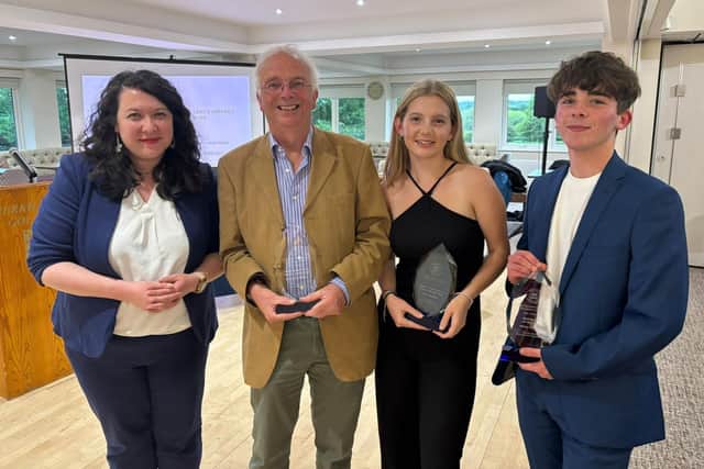 Local MP Victoria Collins (left) with award winners Brian De Mattos, Izzy Thorne and Miles Poulton,