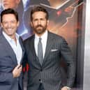 Hugh Jackman (L) and Ryan Reynolds (R) star in the film. (Photo by Monica Schipper/Getty Images for Netflix)