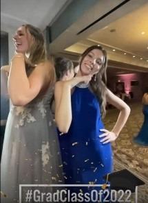 At the photo booth, teenagers pose for their pictures.