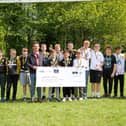 TringRugby U13s present a cheque to Robert Stringer of Hectors House