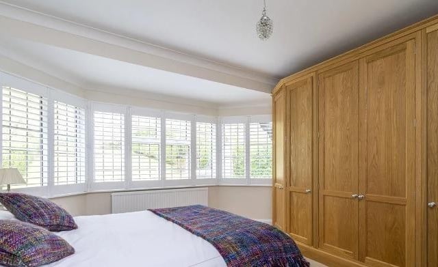 One of three bedrooms in the home, the master room has an en-suite.