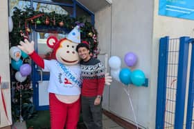 Kit Brown with Monkey Puzzle mascot