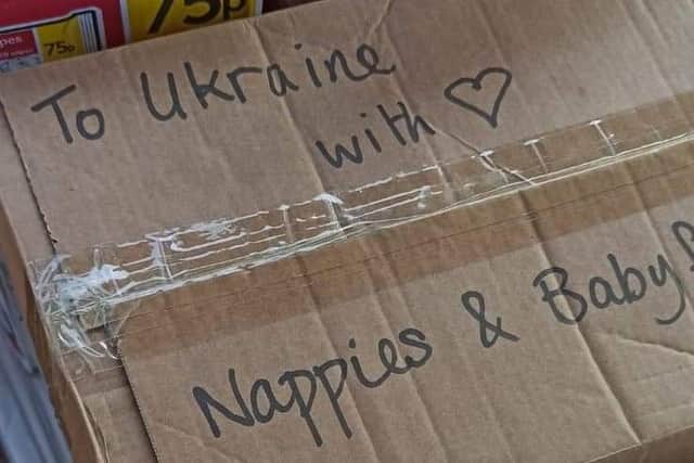 Box filled with baby food and nappies for families in Ukraine.