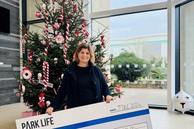 Louise Barron, a trustee for ToyHub, received a £1,000 cheque