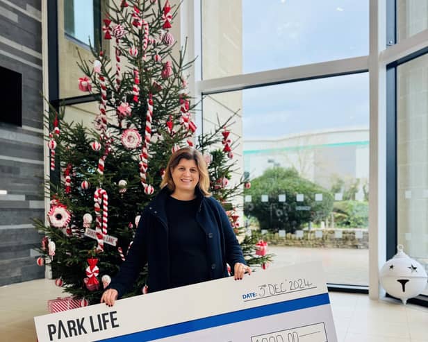 Louise Barron, a trustee for ToyHub, received a £1,000 cheque