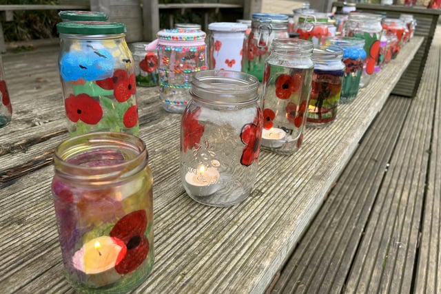 The jars were painted with poppies and had a candle placed inside