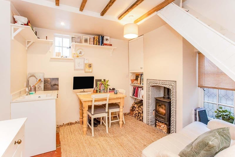 The historic home comes with its very own log burner.