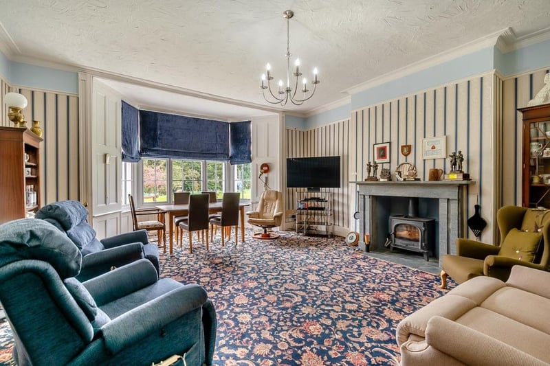 Here is one of the four reception rooms, this one has a dining room in the perfect position for looking out across the garden