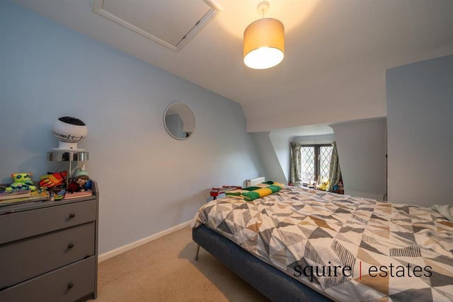 The second double bedroom retains the quirky character vibe.