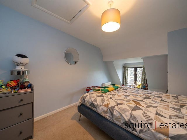 The second double bedroom retains the quirky character vibe.