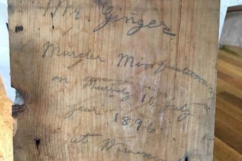 The inscription discovered on a floorboard.