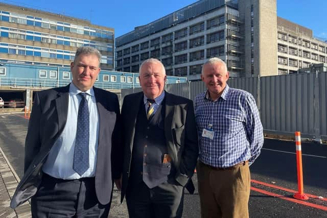 Hemel MP Sir Mike Penning (centre)