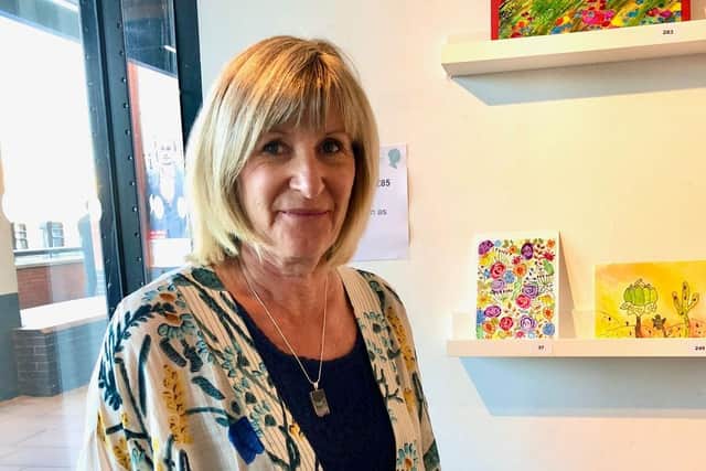 Catherine Archer with her artwork the first year she took part in The National Brain Appeal's A Letter in Mind
