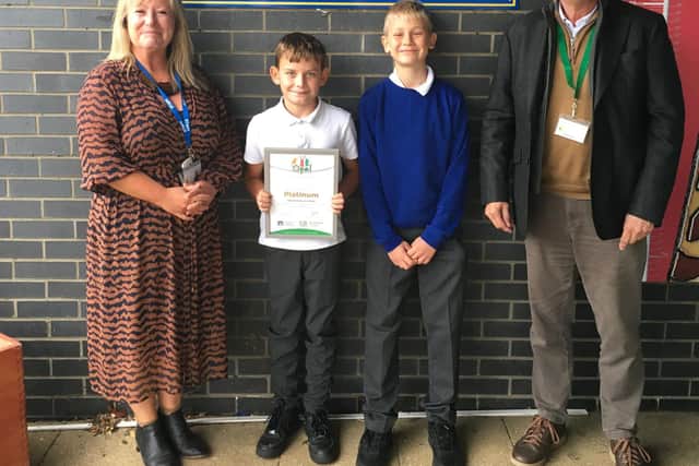 Sarah Elsey, OPAL Leader with Alfie & Filip, play leaders and Neil Coleman, Director of OPAL receiving the Platinum Award on behalf of Galley Hill School.