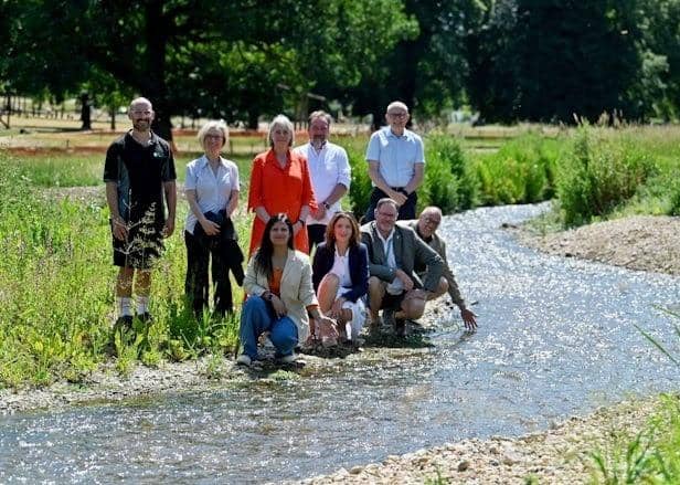 : Councillors and Council officers reviewing the progress of the River Gade restoration Back Row Lt to Rt: Liam Dennis, Project Manager (Environment Agency), Stefania Horne - Strategic Director (Neighbourhood Operations), Cllr Sally Symington – Leader of the Council, Cllr Neil Harden, Darren Welsh - Chief Executive Front Row Lt to Rt: Cllr Simy Dhyani, Cllr Caroline Smith-Wright, Cllr Robin Bromham, Cllr Adrian England