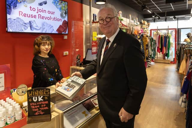 Sir Mike Penning purchases at a book at Hemel Hempstead British Heart Foundation.