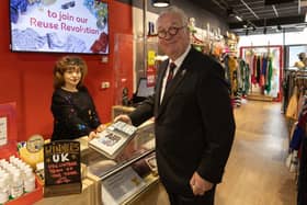 Sir Mike Penning purchases at a book at Hemel Hempstead British Heart Foundation.