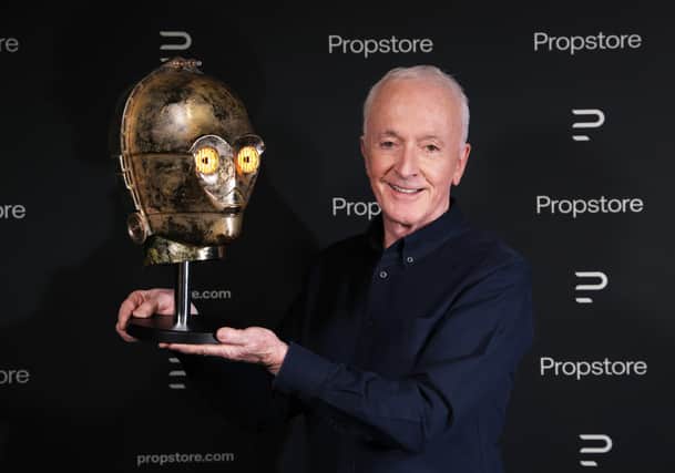 Star Wars actor Anthony Daniels with his C-3PO head from Return of the Jedi.