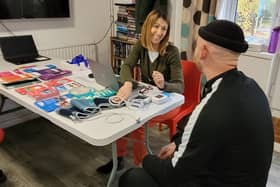 Rachel Canter from Hertfordshire County Council health improvement team with a homeless resident during one of the health sessions.