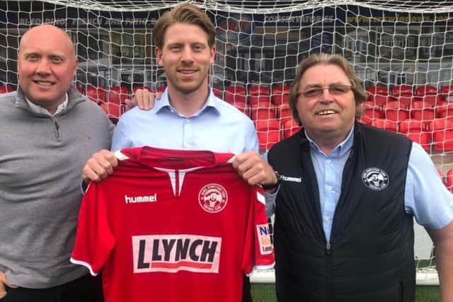 Jack Westbrook pictured with Mark Jones and chairman Dave Boggins after he re-signed for Hemel Hempstead Town. Picture courtesy of Hemel Hempstead Town FC