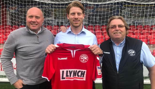 Jack Westbrook pictured with Mark Jones and chairman Dave Boggins after he re-signed for Hemel Hempstead Town. Picture courtesy of Hemel Hempstead Town FC