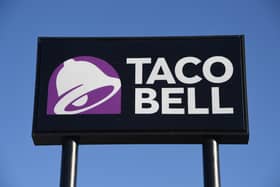 An exterior view shows a sign at a Taco Bell restaurant  (Photo by Ethan Miller/Getty Images)