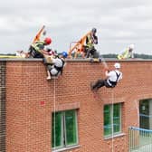 Fundraisers abseil 60ft down the side of the new Paradise development in Hemel Hempstead