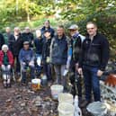 Volunteers celebrate their achievement on the final day of restoration