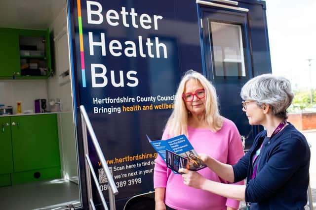 A woman receiving advice outside the Better Health Bus