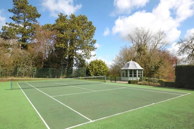 The full size tennis court is one of many luxury features a new owner will inherit.