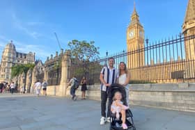 David, Alex and Lexi Robins, from Hemel Hempstead in Hertfordshire, at the Houses of Parliament. Credit: Will Durrant/LDRS