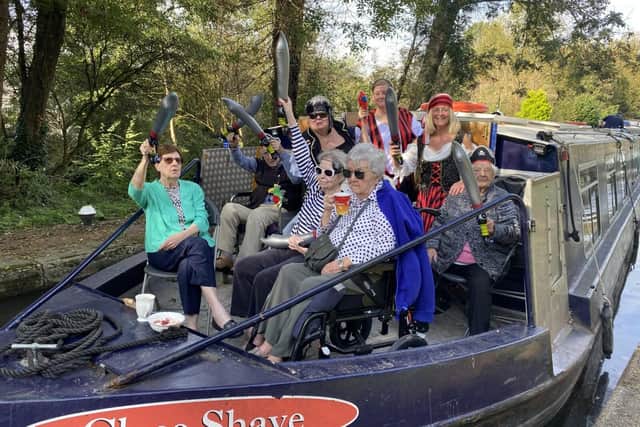 Residents and members of the team from Water Mill House care home aboard the canal boat