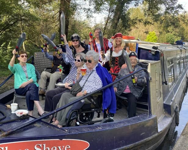 Residents and members of the team from Water Mill House care home aboard the canal boat