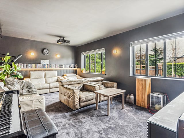 The hall leads through to a TV room, home office and a playroom which is ideal for younger children. There is also a good size utility/boot room.