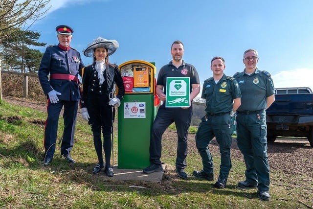 Dignitaries unveiling solar powered defibrillator