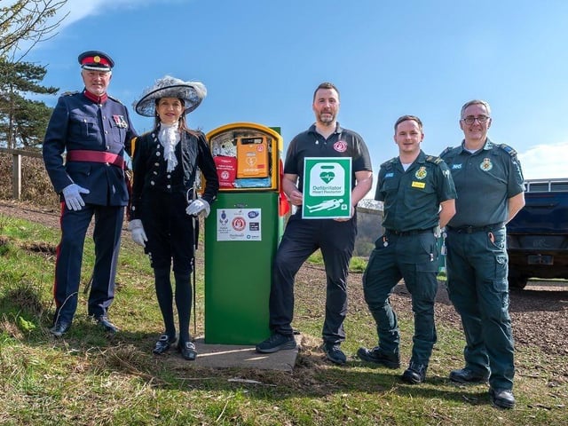 Dignitaries unveiling solar powered defibrillator