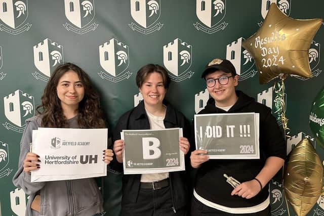 Students achieving exam success.