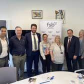 CEO Alex Williams  (far left) next to David Taylor with minister Gareth Thomas (second from right) meeting business owners.