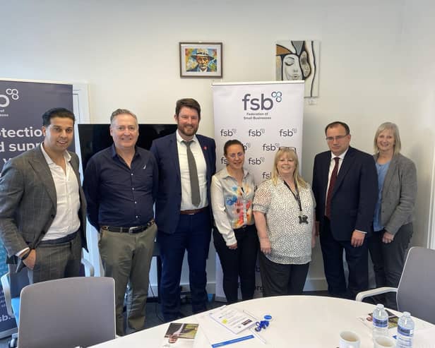 CEO Alex Williams  (far left) next to David Taylor with minister Gareth Thomas (second from right) meeting business owners.