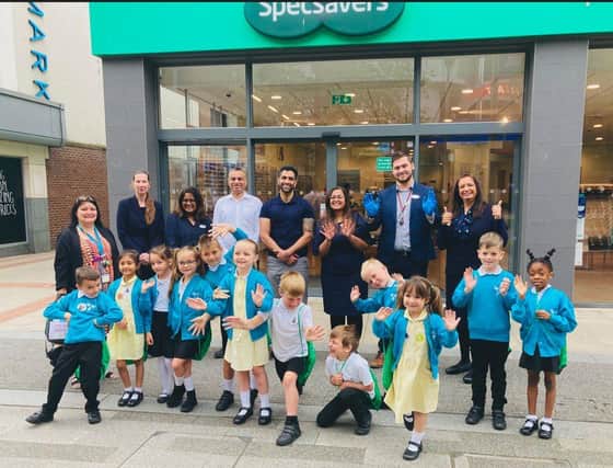 Pupils from Year 1, Jupiter Primary School, (L to R back row) Ms Ria Perry, Year 1 Teacher, Louise England, General Manager, Geeta Patel, Audiology Director, Ash Patel, Ophthalmic Director, Shyam Suchak, Ophthalmic Director, Amy Patel, Optometrist, Harry Hutchings, Hearcare Assistant & Priti Amrania, PR & Community Engagement Lead