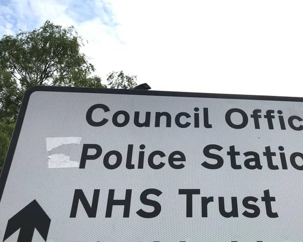 A sign for council offices, police station and NHS Trust in Borehamwood, Hertfordshire. Credit: Will Durrant/LDRS