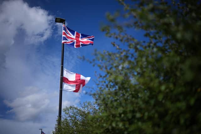 A St George's flag and Union Flag hung from a post in Birmingham used for illustrative purposes. (Photo by Christopher Furlong/Getty Images)