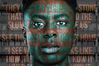 Actor Olatunji Ayofe stood in front of council flats with play quotes over his face.