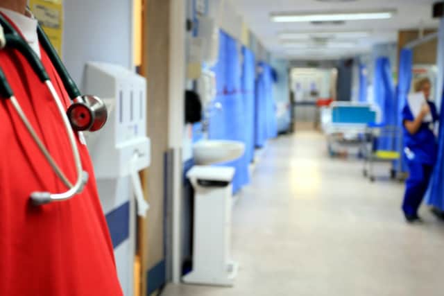 An NHS worker awarded £1,000 after being racially abused has been told he will not receive more money